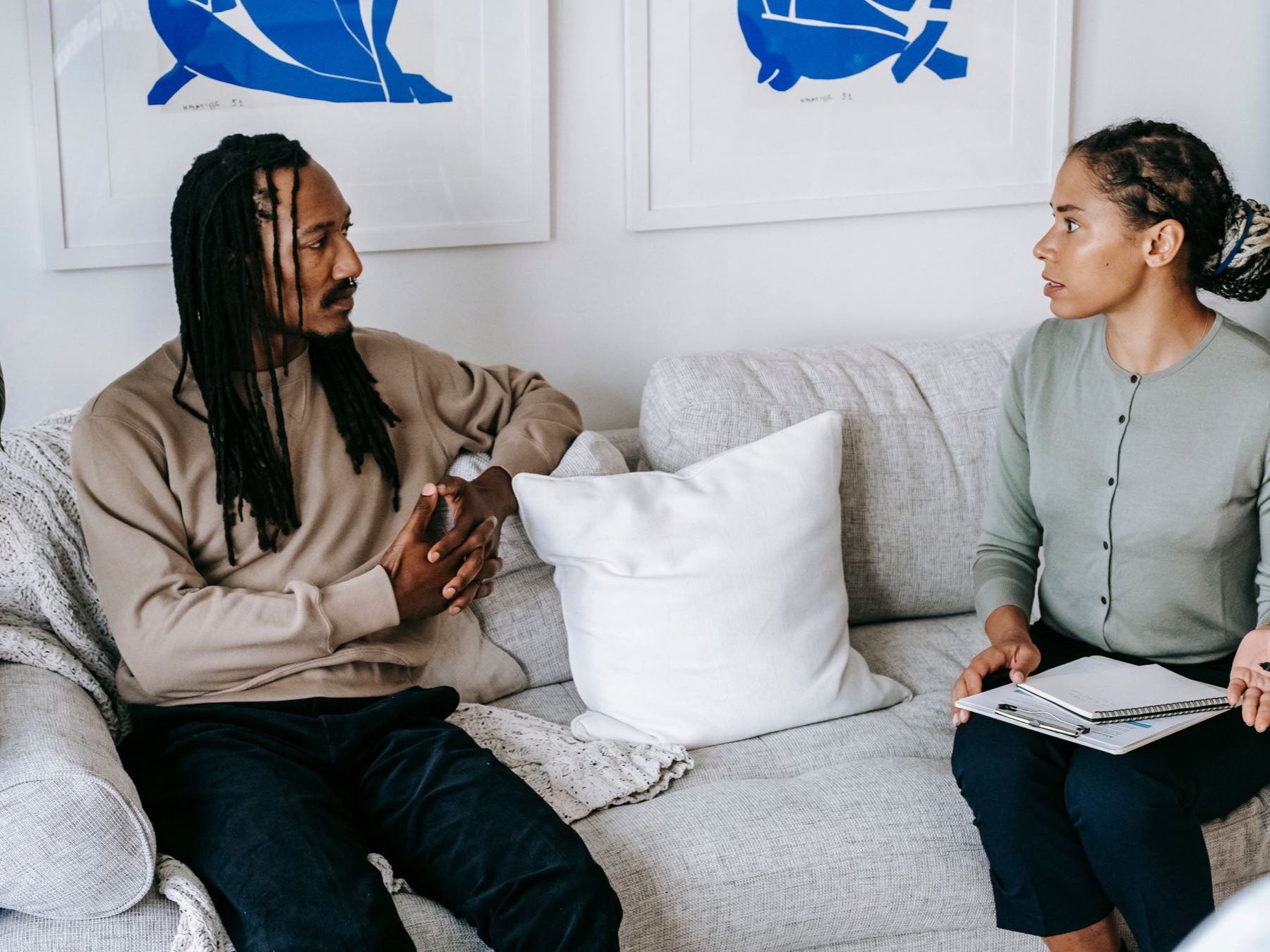 A clinician and patient in conversation during a consultation