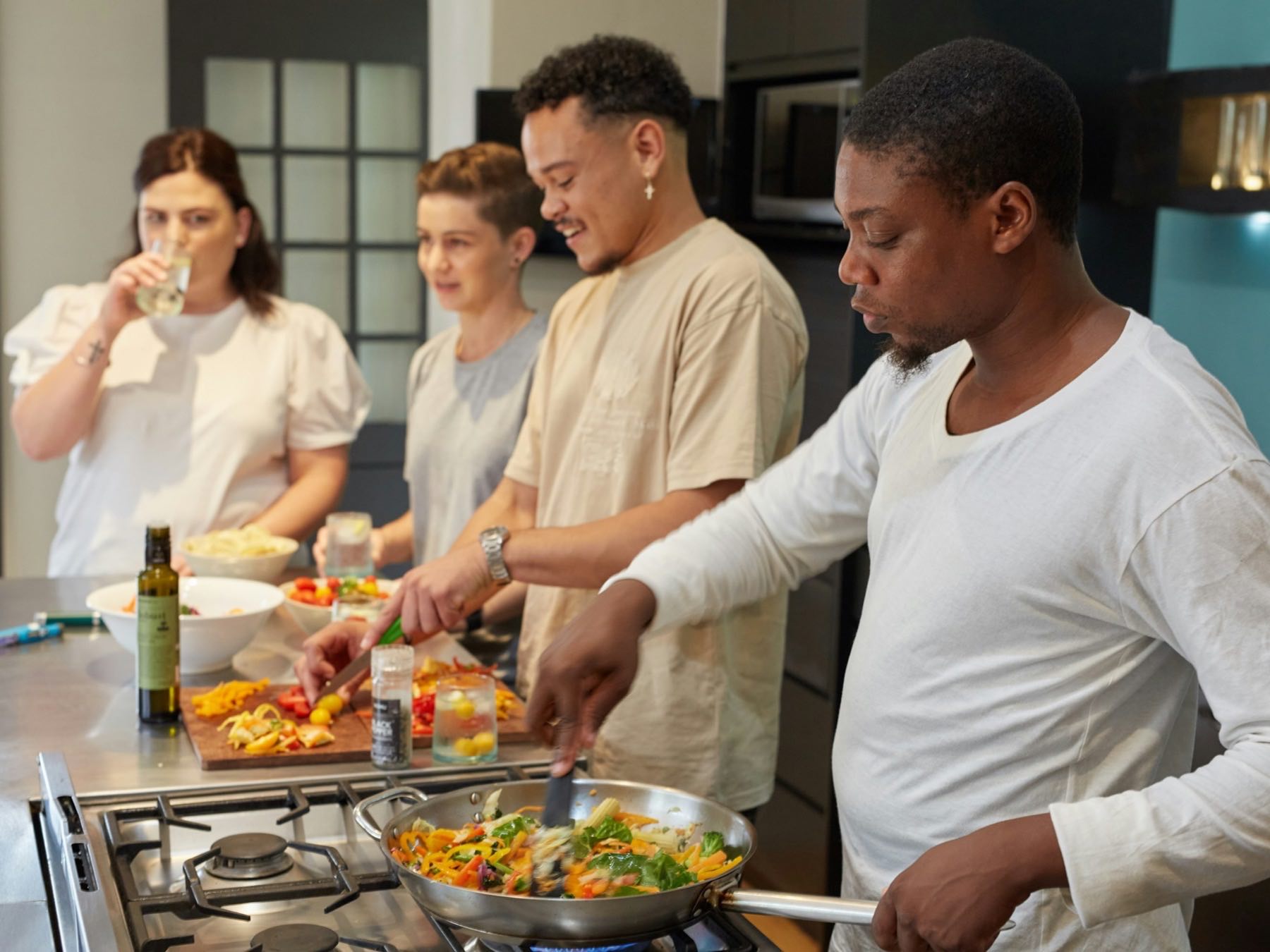 Several people cooking together at a Dr's Kitchen class